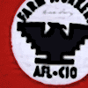 Under the leadership of Cesar E. Chavez, Dolores Huerta and others, the United Farm Workers (UFW) struggled to improve the deplorable conditions of farm workers.  The UFW used community organizing, marches, non-violent resistance and consumer boycotts to rally national support for their cause.  Cesar Chavez's brother Richard Chavez designed the Aztec eagle as the UFW logo, squaring off the edges so that it would be easy for workers to reproduce on flags and posters.